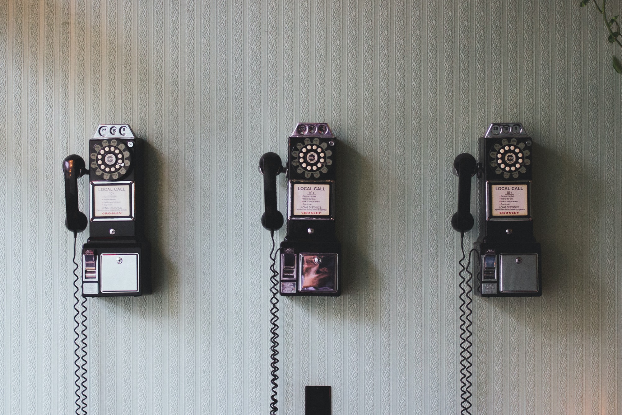 vintage telephone on the wall.